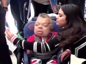 Selena kisses handicapped fan